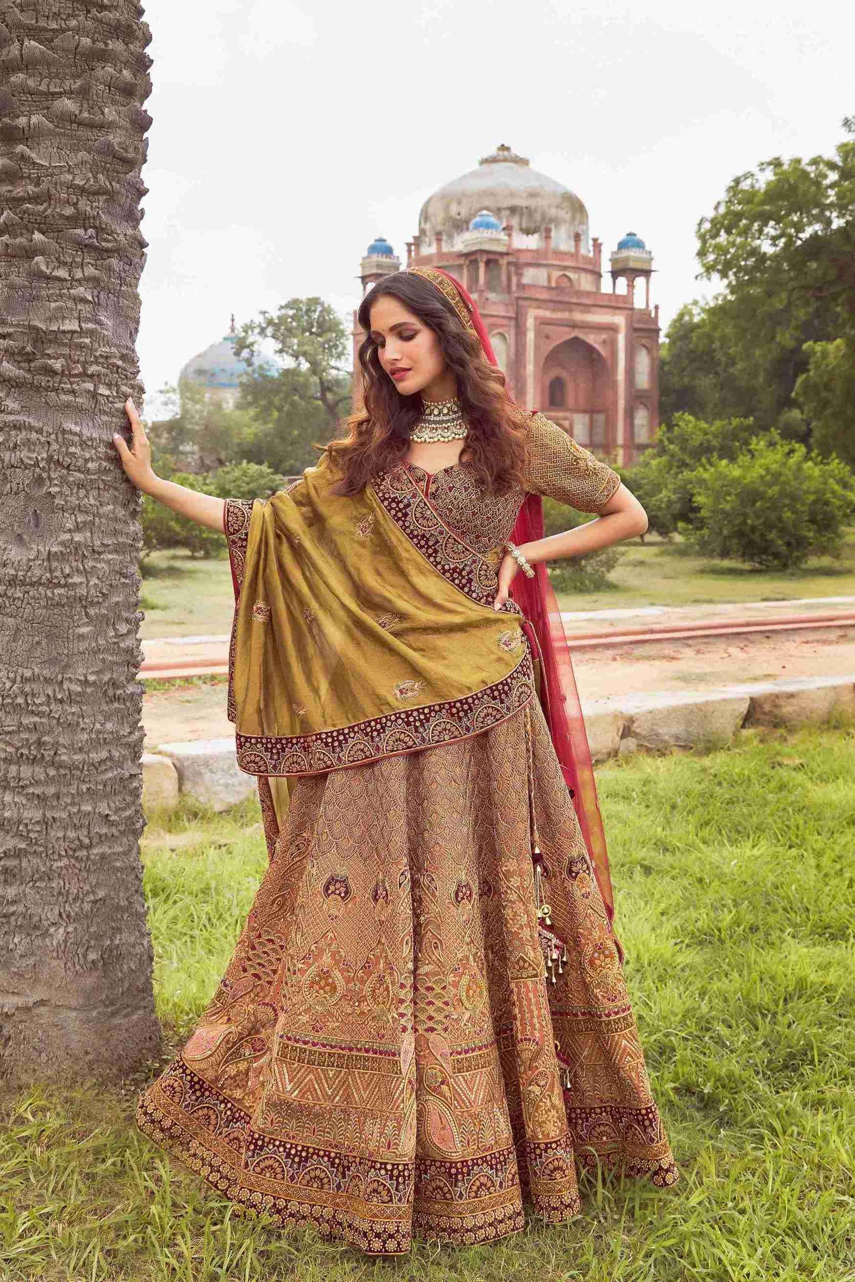 Rust gold raw silk Lehenga Choli embellished with Zardozi and Sequins work - House of Surya