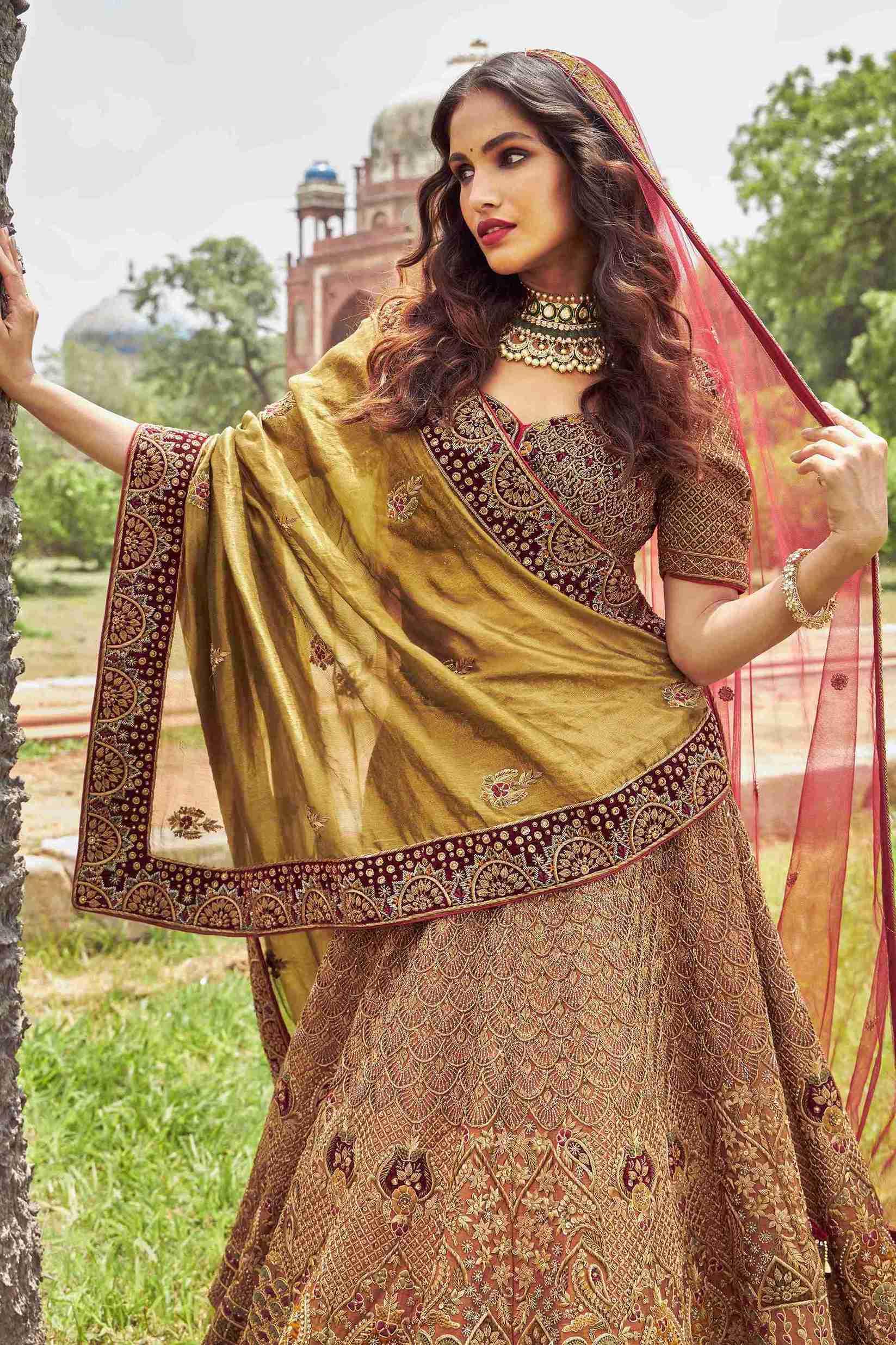 Rust gold raw silk Lehenga Choli embellished with Zardozi and Sequins work - House of Surya