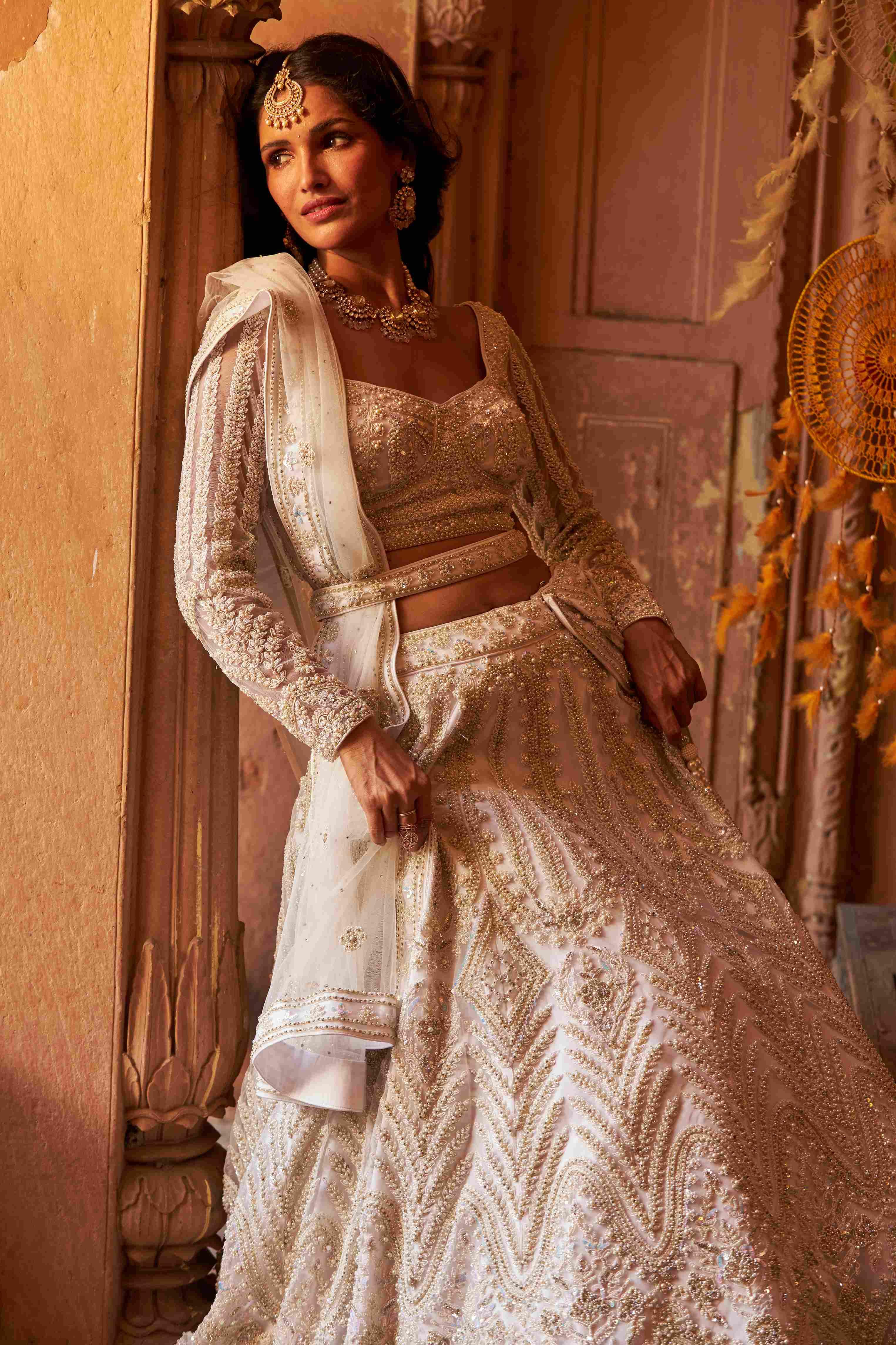 Ivory Net Lehenga with Cutdana, Pearls, Sequins, and Dori Detailing - House of Surya