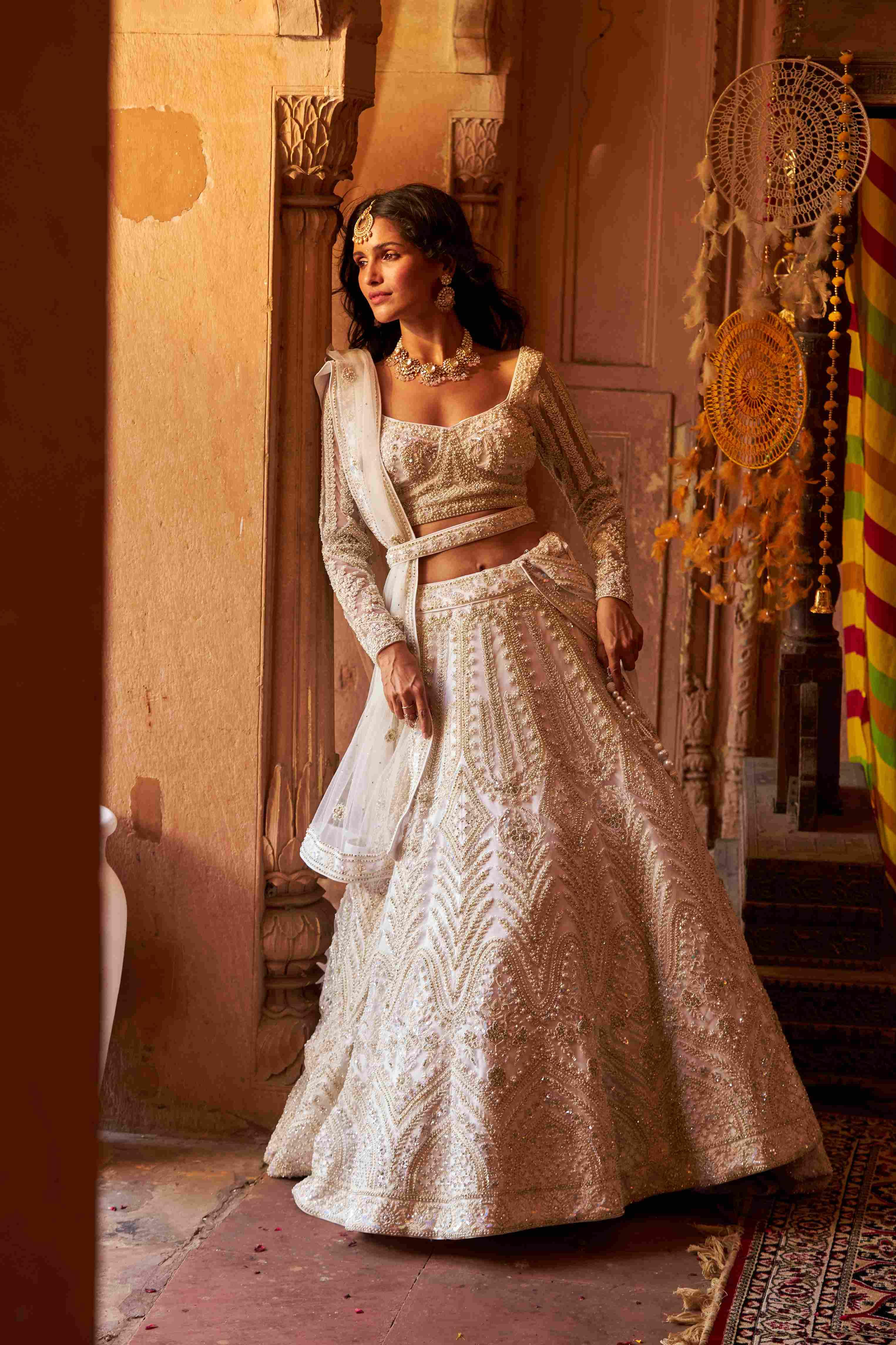 Ivory Net Lehenga with Cutdana, Pearls, Sequins, and Dori Detailing - House of Surya